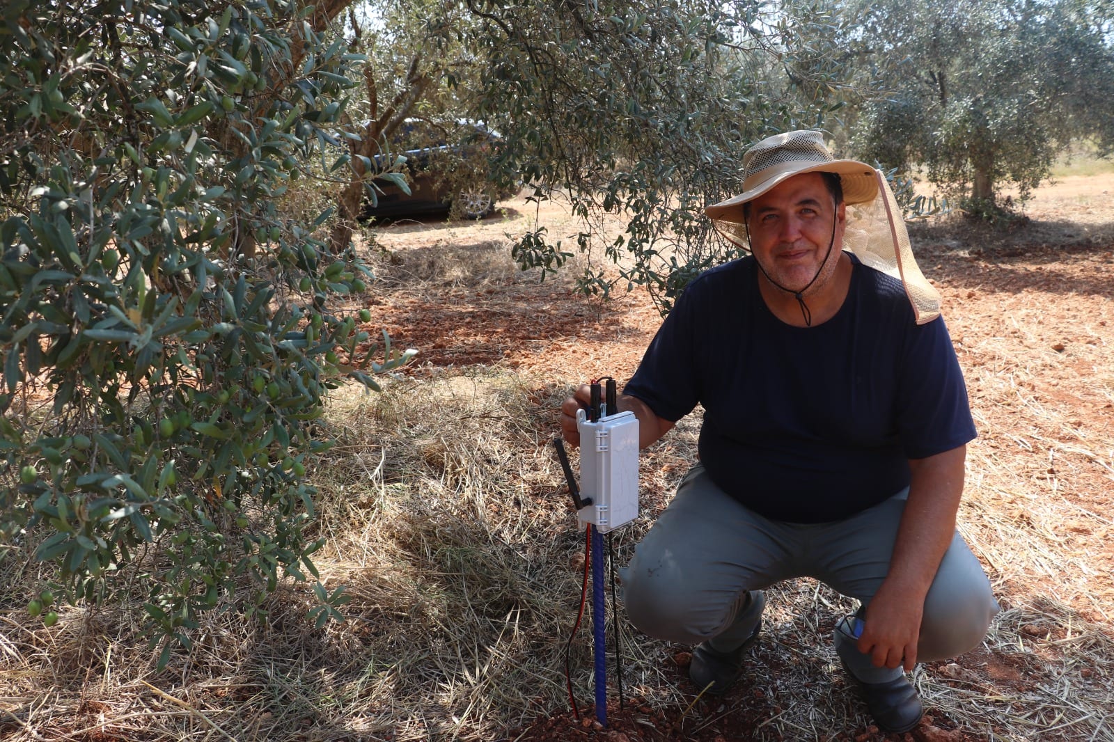 Right after the installation: the president of Tabipler Agricultural Cooperative, next to the Agronode node in the olive grove.